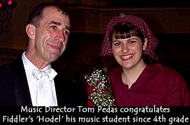 [Tom Pedas with student]